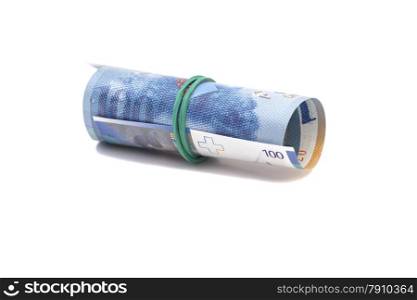 Swiss francs in a roll on white background