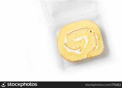 swiss roll in plastic box on white background