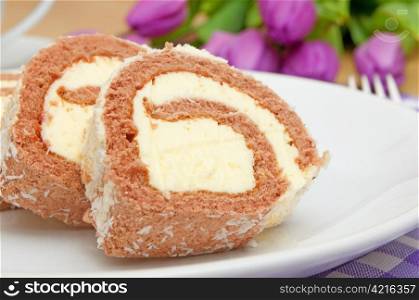 Swiss Sponge Roll With Cream on White Plate - Shallow Depth of Field