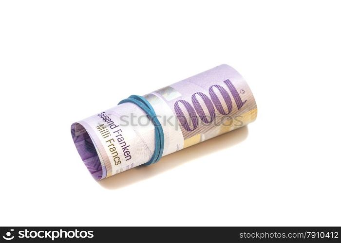 Swiss thousand francs in a roll on white background