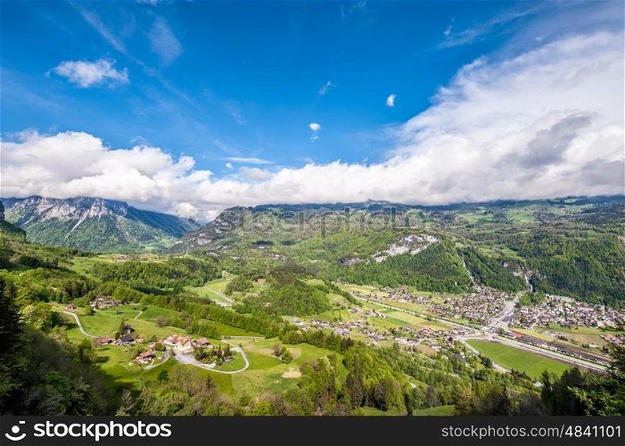 Swiss village in valley under low clouds near Reichenbach, Switzerland