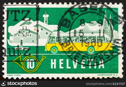 SWITZERLAND - CIRCA 1953: a stamp printed in the Switzerland shows Alpine Post Bus, Winter Background, circa 1953