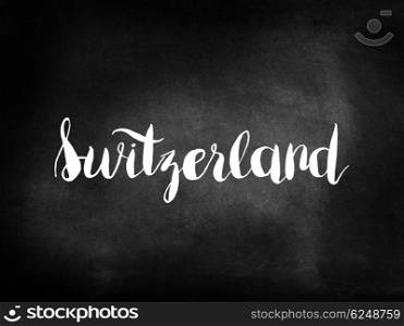 Switzerland written on a blackboard