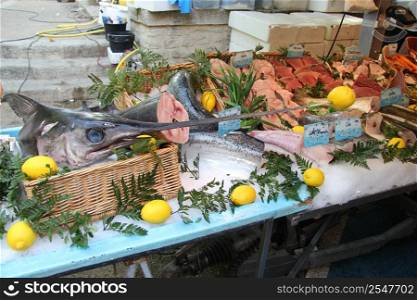 Swordfish, decorated with lemons at a market in France