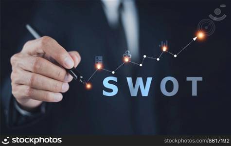 SWOT analysis concept, businessman drawing swot analysis strategy for business plan and growth