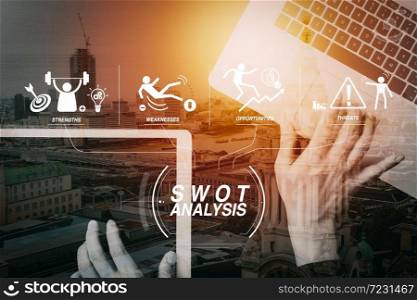 SWOT Analysis virtual diagram with Strengths, weaknesses, threats and opportunities of company.cyber security internet and networking concept.Businessman hand working with laptop computer and digital tablet.