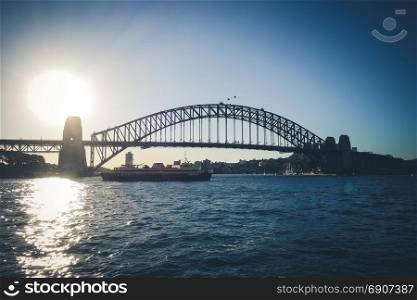 Sydney Harbour Bridge and boat at sunset, Australia. Sydney Harbour Bridge, Australia