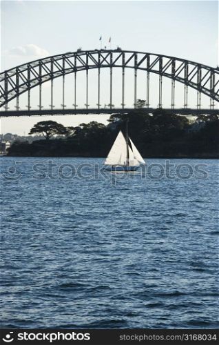 Sydney Harbour Bridge and sailboat in Sydney, Australia.