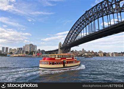Sydney Harbour Ferry. Sydney Habour Ferry Under the Iconic Sydney Bridge in Circular Quay