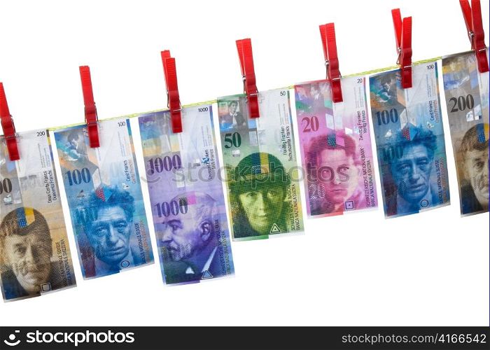 symbol for money laundering by swiss franc on clothesline