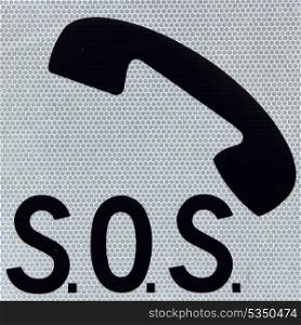 Symbol of a phone and word SOS on a white background