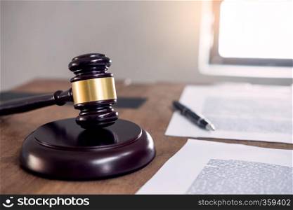 Symbol of Judge law attorney gavel with Justice lawyers table desktop, workplace with documents