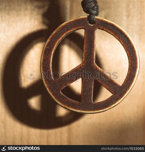 Symbol of peace love and not war of wood with shadow.