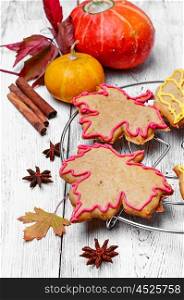 Symbolic autumn cookies. Cookies in the shape of maple autumn leaf in the autumn still life