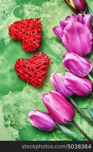 Symbolic heart and flowers Valentine day. Tulips,symbolic of the heart and holiday gift box for Valentine day