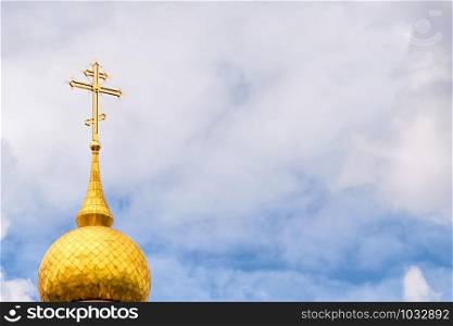 Symbolic image of crucifix on a golden dome of the Birth of Christ Church in the Obolon district of Kiev the capital of Ukraine