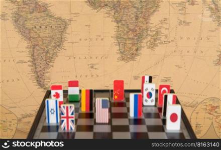 symbols of countries on the chessboard against against the background the political map of the world. Conceptual photo, political games. . chessboard with flags of countries