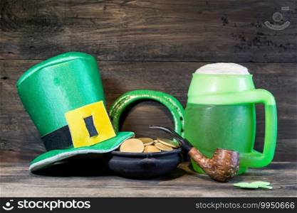 symbols of saint patrick’s day on rustic wood. galley, pipe, beer, clover, coins, symbols of saint patrick’s day on rustic wood