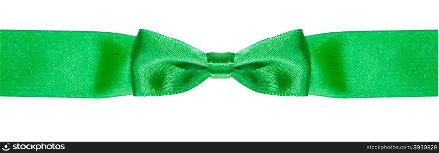 symmetric bow knot on narrow green satin ribbon isolated on white background