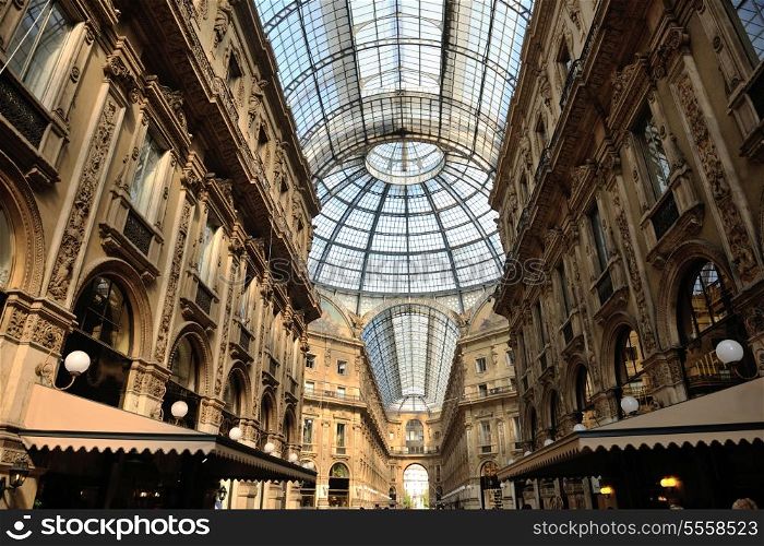 Symmetrical day shot of the hall of the landmark arcade or covered luxury shopping mall, Galleria Vittorio Emanuele II in Milan, Italy