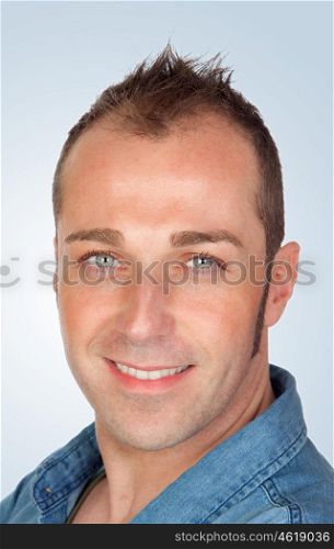 Sympathetic man smiling isolated on blue background