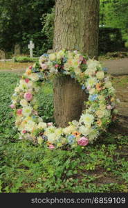 Sympathy wreath in pastel colors, made of various flowers