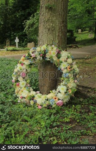Sympathy wreath in pastel colors, made of various flowers