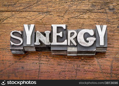 synergy word in vintage metal type printing blocks over grunge wood