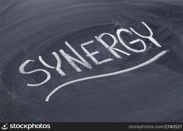 synergy word in white chalk handwriting on blackboard