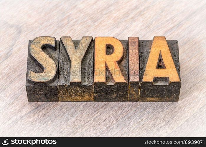 Syria word in vintage letterpress wood type against grained wood