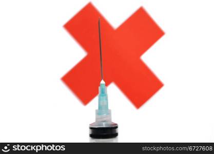 Syringe against red cross