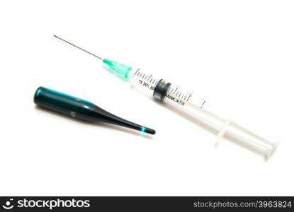 Syringe and ampoule close-up on white background