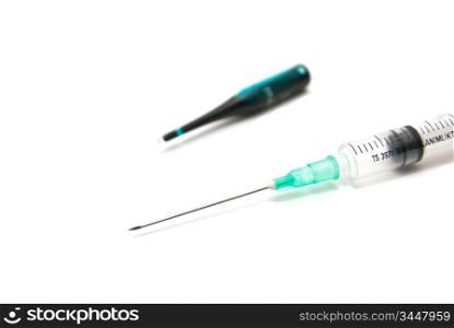 Syringe and ampoule on white background