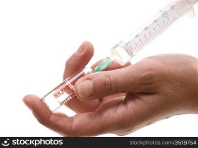 syringe in his hand isolated on a white background