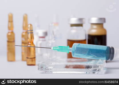 syringe with ampules of drugs