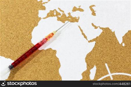 Syringe with vaccine with map of Africa background