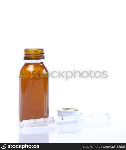 Syrup bottle with syringe on white background.&#xA;