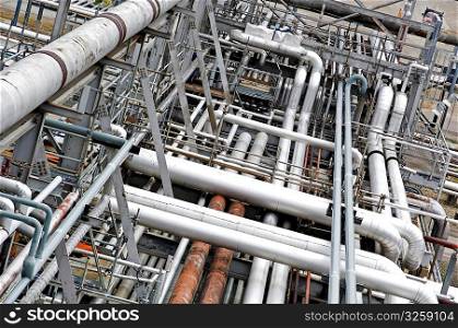 System of layered industrial pipes and ducts.