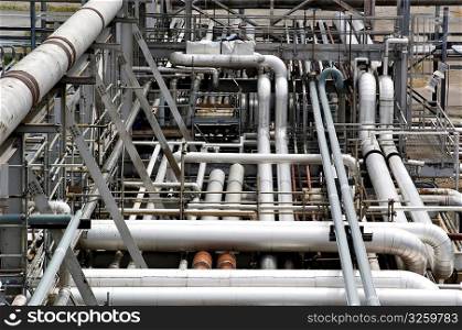 System of layered industrial pipes and ducts.
