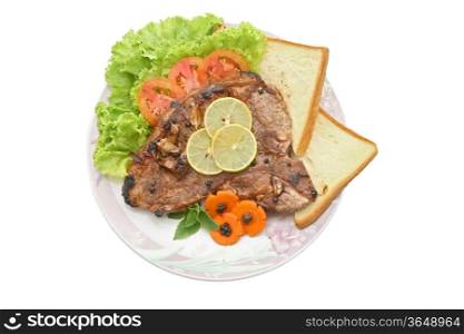 T Bone Pepper Steak with vegetable in dish with knife and fork on White Table