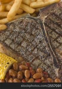 T-Bone Steak with Fries Corn and Beans