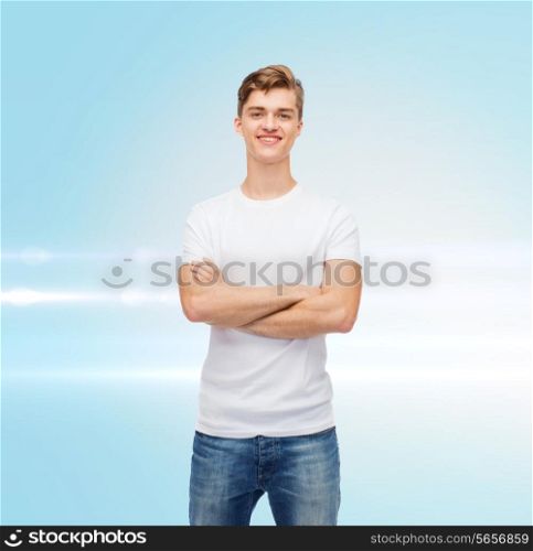 t-shirt design, advertising and people concept - smiling young man in blank white t-shirt over blue laser background