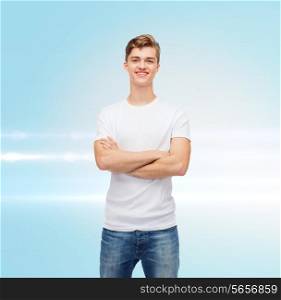 t-shirt design, advertising and people concept - smiling young man in blank white t-shirt over blue laser background