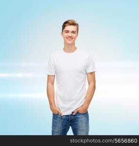 t-shirt design, advertising and people concept - smiling young man in blank white t-shirt over blue laser background