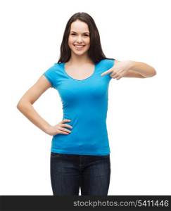 t-shirt design and gesture concept - smiling girl in blank blue t-shirt pointing her finger at herself