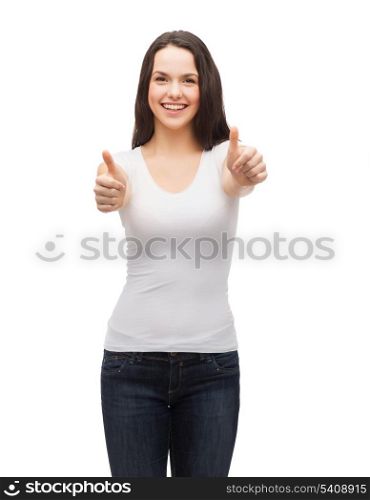 t-shirt design and happy people concept - smiling teenager in blank white t-shirt showing thumbs up