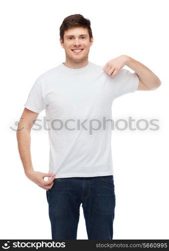 t-shirt design and people concept - smiling young man in blank white t-shirt