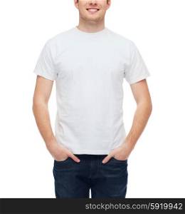 t-shirt design and people concept - smiling young man in blank white t-shirt. smiling young man in blank white t-shirt