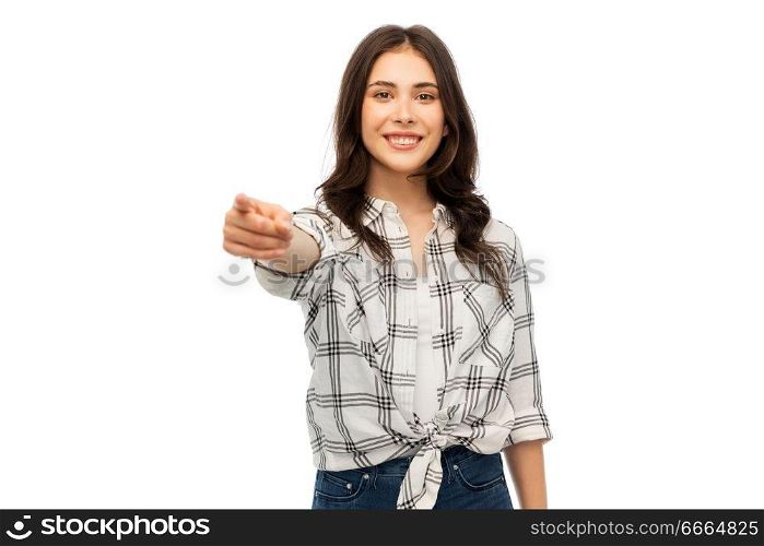 t-shirt design and people concept - smiling young woman in checkered shirt pointing finger at you over white background. young woman or teenage girl pointing finger at you