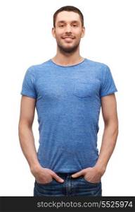 t-shirt design concept - smiling man in blank blue t-shirt